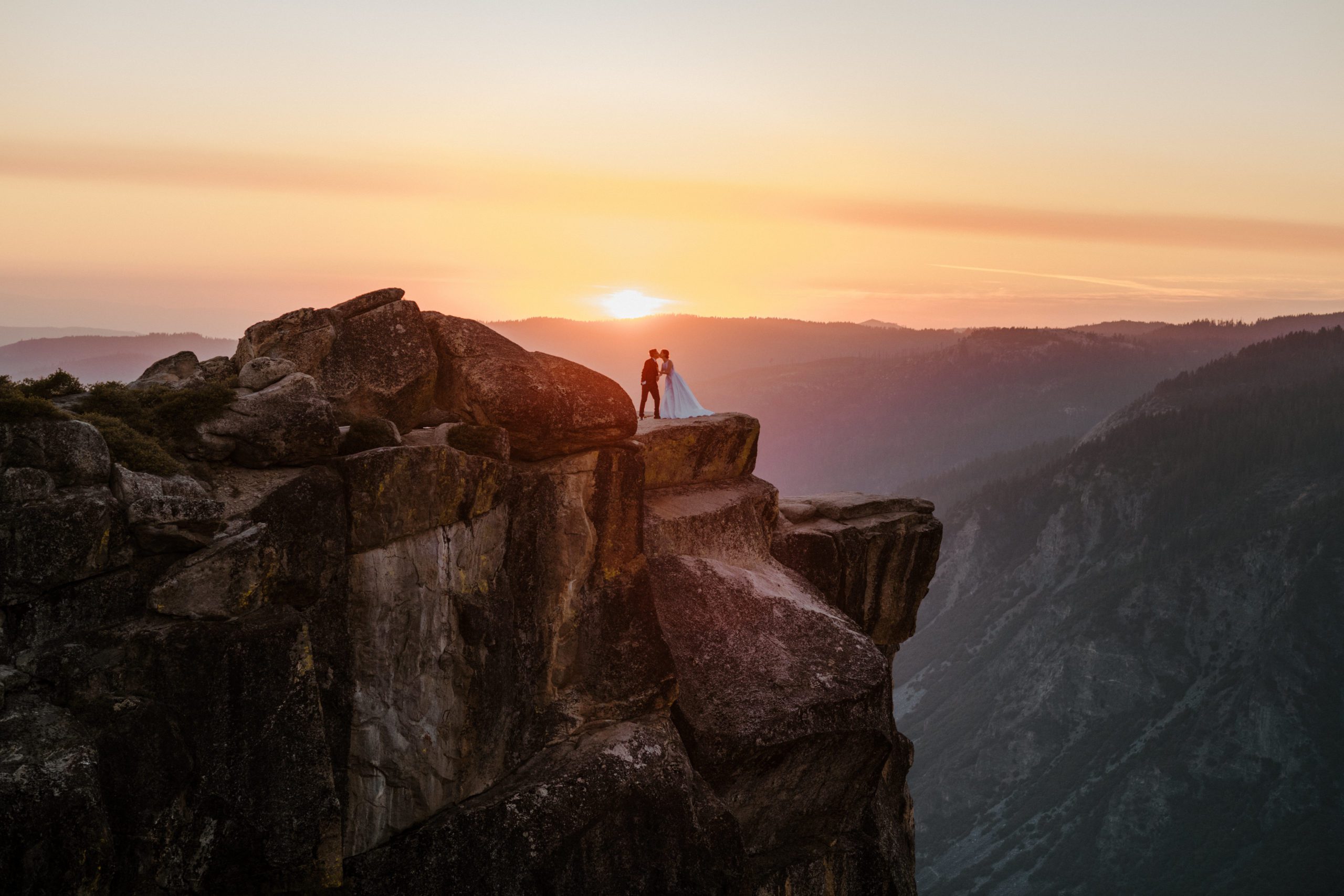 bride and groom at taft point in yosemite taken by sunshine shannon photogaphy